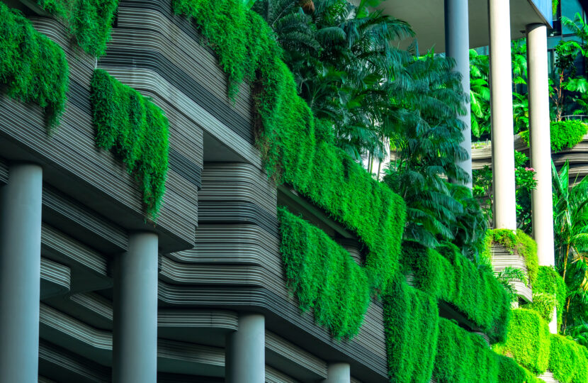 Eco friendly building with vertical garden in modern city