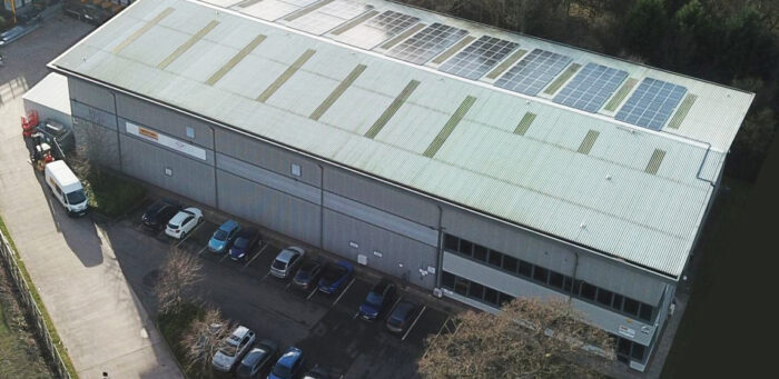 Arial view of a warehouse with solar panels installed